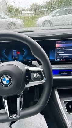 the interior of a car with dashboard, steering wheel and touchscreens on display