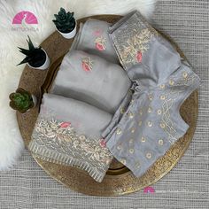 This pure designer embroidered saree has set the new contemporary goals to give you a chic look. Taupe grey colored organza fabricated saree is detailed with gota, dori, resham along  with frilled border is the highlight of this saree. Saree comes with a matching coloured sewn blouse makes you ready to go for any occasion. Please note that this fabric is premium quality silk organza 4*4 (not any mix). Organza Sarees the name itself brings a sparkle in the eyes. An Organza saree is known for its ultra -sophisticated looks and sheer.  Organza is a light weighted fabric which is easy to carry through out the day. Fabric: Organza 4x4 Silk Color: Taupe Grey Blouse: Taupe Grey Stitched blouse Pico, Fall: Stitched - Saree ready to wear  * This is a handwoven saree and slight inconsistencies, if a Grey Colour Blouse Designs, Colour Blouse Designs, Saree Ready To Wear, Designer Silk Saree, Stitched Saree, Organza Silk Saree, Blouse Designer, Designer Silk Sarees, Tissue Saree