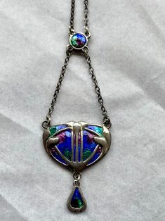 A wonderful sterling silver and enamel necklace by Charles Horner of Halifax. Enamelled in shades of blue green and purple. Excellent condition. Fully hallmarked marked for Charles Horner, Chester 1911. 18" chain. Thanks for looking. Shipping worldwide. Tracked and signed.  Royal Mail I international tracked and signed Covers items up to £250.00 Express delivery fully insured Please note, it is advisable to select the shipping option which offers cover in respect of the articles value. We will not be responsible for any loss or damage during transit. Art Nouveau Necklaces, Enamel Necklaces, Silver Enamel, Green And Purple, Shades Of Blue, Vintage Jewelry, Jewelry Necklace Pendant, Jewelry Necklaces, Pendant Necklace