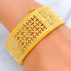 This exquisite 22k gold bangle, weighing 39.9 grams, features a bold and opulent square design that exudes elegance and sophistication. The yellow gold finish enhances its luxurious appeal, making it perfect for any special occasion. The bangle has a size of 2.8 and an opening diameter of 2.5 inches, offering both style and comfort. This piece is openable, designed with a screw and hinge for added convenience. Ideal for those who appreciate high-quality craftsmanship and timeless beauty, this bo Elegant Yellow Gold Cuff Bracelet For Festivals, Gold Rectangular Bangle Gift, Luxury Formal Bangle For Festivals, 22k Gold Bangles, Bridal Jewelry Necklace, Precious Stones Rings, Statement Rings Diamond, Diamond Pendant Sets, Modern Bracelets