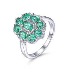 Limited time price. The round emerald stones are very clear, and the color is dark green. Very high-quality silver finish, it does not tarnish.  The diamond is SI1 clarity and G color. All out Emeralds originate from Zambia. Silver 3.80g. Emerald 1.867ct. Diamond 0.036ct. Size #8 Elegant Green Multi-stone Topaz Ring, Exquisite Green Multi-stone Diamond Ring, Green Topaz And Diamond Anniversary Ring, Green Topaz Diamond Ring For Anniversary, May Birthstone Diamond Cluster Ring With Gemstones, Diamond White Emerald Ring With Round Cut, Oval Emerald Ring With Multi-stone Diamond, Anniversary Green Topaz Ring With Diamond, Elegant Cluster Emerald Ring