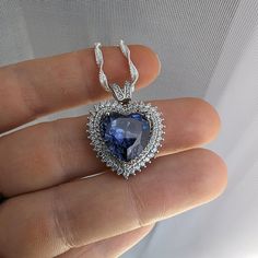 This gorgeous Sterling Silver cubic zirconia studded Tanzanite heart necklace and earring set would make the perfect classy gift for a bridesmaid, as an anniversary gift, for Valentine's Day or for Mother's Day. Tanzanite is the birthstone for those born in December, making it a thoughtful birthday gift as well! Pictures were taken both indoor and outdoors to best represent color. ~Measurements~ The heart pendant measures 1" tall and 3/4" wide. The Tanzanite heart stone is 12mm x 12mm. The match Born In December, Well Pictures, Tanzanite Jewelry, Jewelry Heart, Heart Stone, Jewelry Bridal, Necklace And Earring Set, Hair Accessories Jewelry, December Birthstone