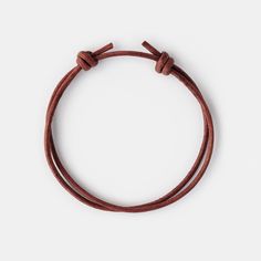 Crafted for comfort and durability, our brown leather cord bracelet with a timeless and simple design is a perfect piece for everyday wear. It would make a perfect graduation gift for your son, a birthday gift for your boyfriend, or a just because gift to surprise your special someone. D E T A I L S * 2mm genuine leather cord. * Adjustable length. Fits all with a wrist from 7" (17.5 cm).  * Designed in Barcelona. All our pieces are crafted by hand and one-of-a-kind, and may therefore vary slight Minimalist Adjustable Leather Bracelet For Everyday Use, Adjustable Waxed Finish Bracelets For Everyday, Everyday Brown Bracelet With Sliding Knot, Adjustable Minimalist Bracelet With Leather Strap, Classic Adjustable Leather Bracelet For Everyday, Brown Minimalist Jewelry With Adjustable Length, Brown Sliding Knot Bracelet For Friendship, Classic Adjustable Brown Bracelets, Adjustable Brown Bracelets For Everyday Use