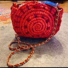 New Women’s Round Straw Cross Bag. 8h 9w 3d. It��’s Fully Lined. It’s A Deep Orange Red Color. Gold Chain Has Orange Unique Webbing. It’s Woven Through. 25 Inches In Crossbody Wrap. 2 Inside Zip Pocket. Toggle Closure. Nwt. Red Woven Crochet Bag For Travel, Red Woven Chic Bags, Red Woven Crochet Travel Bag, Chic Red Woven Bags, Red Woven Shoulder Bag For Travel, Handmade Red Crochet Pouch Bag, Trendy Red Crochet Bag For Daily Use, Trendy Red Crochet Bag, Red Woven Bags