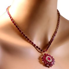 Stamped: 14K Yellow GoldTotal Necklace Weight: 36.0 GramsNecklace Length: 17 InchesNecklace Width: N/AGemstone Weight: Total Natural Center Ruby Weight is 2.35 Carat (Measures: 9.05x6.89 mm)Color: RedGemstone Weight: Total Natural Side Ruby Weight is 56.65 CaratColor: RedDiamond Weight: Total Natural Diamond Weight is 1.00 CaratColor: F-G, Clarity: VS2-SI1Face Measures: 39.77x34.99 mmSku: [702592W] Dazzling Multi-stone Necklace For Formal Occasions, Formal Ruby Necklace With Hallmark, Formal Multi-stone Costume Jewelry Necklace, Formal Multi-stone Ruby Jewelry, Formal Oval Necklace With Stones, Formal Oval Necklaces With Stones, Formal Ruby Gemstone Necklaces, Formal Ruby Gemstone Necklace, Formal Yellow Gold Necklace With Ruby