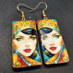 These image transfer earrings are ready to ship.  The earrings are handcrafted from polymer clay and uses my own image transfer technique. They have a top layer of resin. Artistic Handmade Rectangular Earrings, Artsy Enamel Drop Earrings, Handmade Artistic Rectangular Earrings, Bohemian Resin Earrings With Ear Wire, Bohemian Gold Resin Earrings, Hand Painted Resin Earrings For Gifts, Handmade Multicolor Resin Earrings, Hand Painted Resin Earrings As Gift, Artistic Hand Painted Gold Earrings