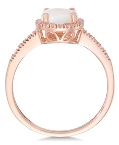 Magical shine. Indulge in this sophisticated piece, featuring round-cut opal (3/4 ct. t.w.) surrounded by sparkling diamonds (1/8 ct. t.w.). Ring set in 14k rose gold. Macy's Fine Jewelry Promise Ring, Macy's Round Cut Ring As Gift, Macy's Round Cut Rings As Gift, Macy's Classic Rings With Diamond Accents, Elegant Macy's Jewelry With Center Stone, Macy's Classic Diamond White Ring, Classic Macy's Diamond White Rings, Macy's White Round Cut Rings, Macy's White Round Rings