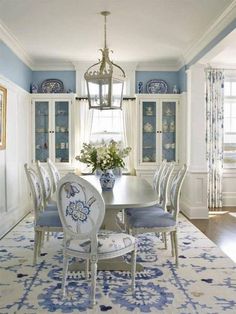 a dining room with blue and white decor