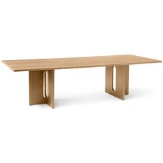 a wooden table sitting on top of a white floor