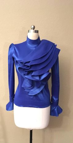 Elegant Ruffled Tops For Party, Elegant Party Tops With Ruffles, Chic Fitted Ruffle Blouse, Elegant Evening Tops With Ruffle Hem, Elegant Ruffle Hem Top For Evening, Elegant Evening Top With Ruffle Hem, Chic Fitted Blouse With Ruffles, Elegant Ruffled Stretch Top, Elegant Stretch Tops With Ruffles