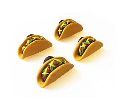 three tacos are shown on a white background