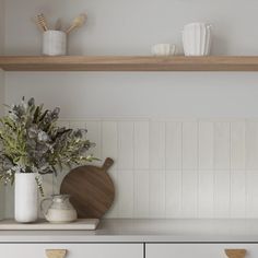 the kitchen counter is clean and ready to be used as a shelf for cooking utensils