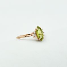 "Description Stone Name: Natural Peridot Shape : Marquise Stone Size : 5x10 mm Nickel Free) - also available in 925 sterling silver with rose gold plated Metal: 925 Sterling Silver Beautifully handcrafted as u can see in pics100% handmade more quantity available on demand We accept Custom Order If you have any questions about this piece or if we can help you with any of our other products please feel free to contact us through Etsy I am more than happy to make customs orders or price for wholesa Halo Ring Engagement, Aquamarine Ring Vintage, Ametrine Ring, Blue Aquamarine Ring, March Birthstone Ring, Green Gemstone Ring, Engagement Ring Photos, Sparkly Ring, Ring Marquise