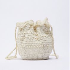 Zara Fabric Mini Bucket Bag New With Tag Fabric Mini Bucket Bag. Top With Embroidered Details. Lined Interior. Handles And Ruched Closure. Height X Length X Width: 7.9 X 7.5 X 4.1 Inches (20 X 19 X 10.5 Cm) Outer Shell Main Fabric: 100% Polyester Embroidery: 100% Cotton Shoulder Strap: 100% Nylon Lining: 100% Polyester Cream Pouch Bag For Errands, Pouch Crochet Bag For Errands, White Crochet Pouch Bag For Mobile Phone, Zara Pouch Shoulder Bag For Daily Use, White Straw Bag With Removable Pouch, White Straw Pouch Bag With Removable Pouch, White Summer Clutch Bag, White Clutch Bag For Summer, White Crochet Pouch Bag With Removable Pouch