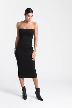 When sleek is spectacular. Our strapless midi Natalia Dress is the versatile LBD you’ve been waiting for. Our soft, structured and mid-stretch European ponte fabric gives her a slight sheen and a smoothing fit, while her sleek silhouette makes Natalia effortless to dress up or down. Wear her to date-night cocktails just as easily as you might to run around the corner - Natalia will go everywhere with you.[SPLIT] Sam is 5'8" (173 cm) tall, wearing size XS. Total length approximately 38" (95 cm). Elegant Spring Stretch Tube Top, Elegant Stretch Tube Top For Spring, Elegant Spring Tube Top With Stretch, Chic Stretch Strapless Dress, Strapless Elastane Midi Dress, Strapless Elastane Midi Dress For Party, Chic Smoothing Bodycon Dress, Elastane Midi Dress With Straight Neckline For Night Out, Stretch Strapless Knee-length Cocktail Dress