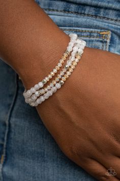 A dainty collection of icy white and iridescent crystal-like beads join mismatched silver accents along stretchy bands around the wrist, creating whimsical layers.

 Sold as one set of three bracelets. Wedding Brainstorming, White Beads Bracelet, Candy Bracelet, Beaded Jewelry Bracelets, Diy Beaded Bracelets, Bracelets Ideas, White Bracelet, Green Cactus, Iridescent Crystal