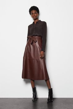 Designed To Elevate Your Day-To-Day Styling, This Leather Skirt Is What You'Ll Be Wearing On Repeat. It Features Patchwork Panelling, Tie-Waist Belt With Stitched Detail, Side Pockets And Comes In A Midi Length. Belted Skirt For Workwear In Fall, Belted Skirt For Fall Workwear, Fall Workwear Belted Skirt, Fall Office Belted Skirt, Fall Workwear Skirt With Belt Loops, Modern Office Skirt For Fall, Office Skirt With Belt Loops For Fall, Leather Belted Bottoms For Work, Fall Brown Belted Skirt