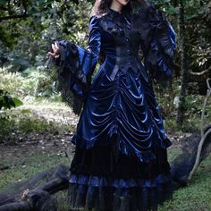 An item that will make you look like a mysterious and elegant young lady. A gothic blouse richly decorated with black lace embroidery, a tiered skirt that captivates the eye with its elegant volume, and an embroidered fishtail skirt with different lengths at the front and back. Like an aristocratic lady from medieval Europe. 
 
 

 

 
 
 Item 
 
 Blouse (navy) 
 Tiered skirt (navy) 
 Fishtail skirt (black) 
 
 
 Size 
 
 Blouse 
 
 XS size 
 
 Length (front): 59cm 
 Length (back): 73cm 
 Should Halloween Victorian Dress With Ruffles, Victorian Ruffled Dress For Halloween Costume Party, Halloween Victorian Dress With Ruffles For Costume Party, Gothic Tiered Ruffle Skirt, Victorian Long Sleeve Party Dress, Gothic Dresses With Lace Patchwork, Gothic Style Dress With Lace Patchwork, Gothic Long Sleeve Halloween Vintage Dress, Gothic Long Sleeve Vintage Dress For Halloween