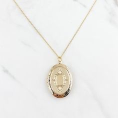 Dainty Gold Oval Locket Necklace, Dainty Gold Oval Pendant Locket Necklace, Gold Locket Necklace With Oval Pendant, Gold Oval Charm Necklace With Adjustable Chain, Dainty Gold Locket Necklace As Gift For Her, Gold Locket Necklace As Gift For Her, Gold Oval Locket Necklace As A Gift, Gold Oval Pendant Locket Necklace Gift, Oval Gold Necklaces As A Gift For Her