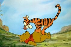 winnie the pooh and tigger on top of each other in front of a blue sky