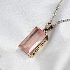 Rose Quartz Baguette Shape Women's Pendant With Moissanite Accents Caliber Size Silver Pendant For Women| Gift For Wife/Anniversary Gift. Embrace the enduring beauty and tranquil energy of the Enchanting Rose Baguette Shape Pendant, featuring exquisite rose quartz cut stone caliber size. This pendant is a timeless emblem of love and serenity, evoking feelings of warmth, compassion, and inner peace. At the heart of the pendant lies a stunning rose quartz, meticulously cut to reveal its natural beauty and delicate pink hue. The soft, rosy tones of the rose quartz symbolize love, compassion, and emotional healing, making it a cherished gemstone that resonates with the heart and soul. Crafted with precision and care, the pendant showcases the natural elegance of the rose quartz in a sleek and Exquisite Rectangular Jewelry For Gift, Exquisite Rectangular Jewelry Gift, Elegant Rose Gold Jewelry With Rectangular Stone, Rose Gold Baguette Cut Jewelry Gift, Rose Gold Baguette Cut Necklace For Gift, Elegant Rectangular Necklace For Mother's Day, Diamond Cut Morganite Jewelry Gift, Morganite Jewelry With Diamond Cut As Gift, Rose Gold Jewelry With Rectangular Stone For Gift