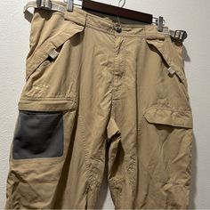 Men’s Light Khaki Colored Tactical Cargo Pants For Casual And Performance Wear. Double Pockets On Sides Of Each Leg (Outer Mesh Slip In Pocket With An Inner Zipper Closure Pocket, See Last Picture.) Velcro Pockets With Mesh Inner Lining On Each Thigh And On Each Side Of The Butt, 4 Total. Adjustable Waist And With Belt Loops. No Stretch. Size Xl Color Is A Light Khaki / Tan / Brown Condition Is New Without Tags / Like New, I Found Zero Flaws If You Need The Exact Measurements Of The Waist, The I Tactical Parachute Pants For Outdoor Activities, Tactical Khaki Bottoms For Outdoor Activities, Techwear Cargo Pants For Outdoor Work In Khaki, Khaki Techwear Cargo Pants For Outdoor Work, Techwear Style Khaki Cargo Pants For Outdoor Work, Tactical Khaki Cargo Pants For Outdoor Work, Khaki Techwear Cargo Pants For Hiking, Tactical Hiking Bottoms With Cargo Pockets, Utility Cargo Pants With Pockets For Camping