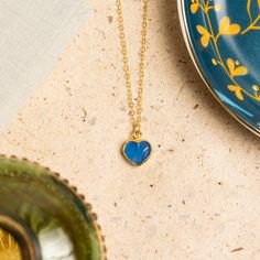 Blue Chalcedony Mini Heart Pendant - Heart shape gemstone pendant with vermeil gold bezel - Jewelry gifts for her, mom, wife, daughter Stone: Genuine Blue Chalcedony Heart Gemstone: 10mm x 10mm Gold chain: 14k gold filled Chain length: 16-18 inches adjustable Clasp: spring ring Bezel: Vermeil Gold About "Gold Filled Jewelry": Also called rolled-gold. These jewelry items are not actually filled with gold. They are made of a base metal covered by sheets of gold in a mechanical bonding process. Eff Blue Heart Charm Necklaces, Sapphire Necklace For Valentine's Day Gift, Blue Heart Charm Necklace, Blue Heart Pendant Necklace For Mother's Day, Blue Heart Charm Necklace For Mother's Day, Blue Heart Pendant Necklace With Birthstone, Blue Birthstone Heart Pendant Necklace, Blue Necklace For Mother's Day Gift, Blue Gemstone Heart Necklace For Gift