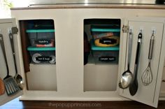 kitchen utensils are stored in the cabinets