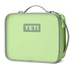 a green lunch box with the word yet on it