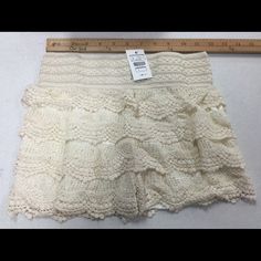 So, I Ordered These In A Large And As You Can See They Are Small! Would Say They Are Closer To A 2/4. The Waist Will Stretch A Lot. About To 30" And Still Comfortable. Beige Lace Bottoms For Spring, Spring Lace Beige Bottoms, Spring Beige Lace Bottoms, White Casual Bottoms With Crochet Trim, Casual White Bottoms With Crochet Trim, White Lace Bottoms With Elastic Waistband, Beige Lace Trim Shorts, White Cotton Shorts With Crochet Trim, Beige Bottoms With Crochet Trim For Spring