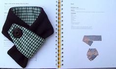 an open book with ties and other items on the pages, including a buttoned necktie