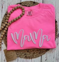 I love this Neon Pink Mama tee with 3D puff embroidery!  The perfect tee for Summer! Made with LOVE in Oklahoma.   Comfort Color 6.1 oz 100% ring spun cotton. Unisex sizing for a relaxed fit. Suggested sizes: S (0-4) M (6-10) L (10-14) XL (14-18) *Processing TIme* Please allow 5-7 days for production.  We ship USPS, normally allow up to 7 days for shipping. *Care Instructions* Wash inside out, cold.  Lay flat to dry.  Lightly iron if necessary, but NOT over the embroidery Return/Exchange Policy: Cotton T-shirt With Letter Embroidery For Birthday, Birthday Crew Neck T-shirt With Embroidered Text, Birthday Embroidered Text T-shirt With Crew Neck, Casual T-shirt With Embroidered Text For Mother's Day, Pink Crew Neck T-shirt With Embroidered Graphics, Mother's Day Pink Graphic Tee, Pink Short Sleeve T-shirt With Embroidered Graphics, Embroidered Crew Neck Birthday T-shirt, Pink Cotton T-shirt With Embroidered Graphics