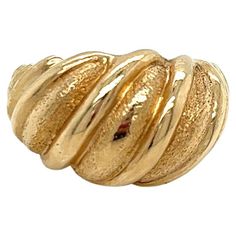 Vintage 1980's 14k Yellow Gold Shrimp Dome Statement Ring. The design is alternating shiny and textured ridges. The ring on top measures 12mm and tapers to 5mm on the side. The height of the ring off the finger is 6mm. The width of the band on the bottom is 3.7mm wide. The finger size is 6.75 and it can be sized upon request. The ring weighs 6.94g. Victorian Gold Domed Rings, Vintage 14k Yellow Gold Dome Ring, Luxury Vintage Gold Dome Ring, Gold Vintage Dome Ring, Tarnish Resistant, Vintage 14k Gold Tarnish-resistant Dome Ring, Bow Ring, The Ring, Statement Ring, Fashion Rings