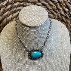 Turquoise stone necklace with matching silver earrings. Sterling Silver Turquoise Necklace With Adjustable Chain, Nickel-free Elegant Turquoise Necklace, Turquoise Pendant Necklace In Metal, Turquoise Necklace With Large Oval Pendant, Turquoise Metal Pendant Necklace, Turquoise Necklace With Large Oval Stone Pendant, Turquoise Necklace With Large Oval Stone, Nickel-free Turquoise Pendant Necklace, Elegant Turquoise Necklace With Oxidized Finish