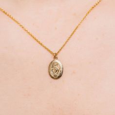 This gold-filled double-clad pendant necklace features a Miraculous Medal—also known as the Medal of the Immaculate Conception—design with fine details. When the medal first came into being, it was called the Medal of the Immaculate Conception. In less than ten years it became known at the Miraculous Medal because of the many graces and wonders that quickly became associated with wearing it. Having this medal around our necks at all times is a constant reminder to pray. And as Mary promised, tho Gold Pendant Charm Necklace With Miraculous Medal, Gold Miraculous Medal Pendant Necklace, Dainty Charm Necklaces With Miraculous Medal As Gift, Dainty Charm Necklaces With Miraculous Medal For Gifts, Dainty Miraculous Medal Charm Necklaces As Gifts, Dainty Miraculous Medal Charm Necklace As Gift, Dainty Oval Pendant Charm Necklace, Virgin Mary Necklace Gold, Mary Necklace Gold