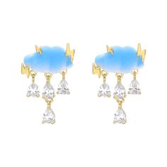 Description: Our Cosmic Blue Clouds Earrings are a unique blend of fun and delicacy. These earrings feature a charming blue cloud design with a dangling gem that resembles a sparkling drop of rain, creating a delightful and playful composition. Designed to brighten your day, adding a touch of charm and imagination to your look. Details: 18K Gold Plated Sterling Silver Posts Anti-tarnish, anti-allergy, nickel-free. Designed in USA Jewelry Care Please avoid contact with moisture or alcohol product Whimsical Blue Drop Earrings, Trendy Light Blue Dangle Earrings, Blue Drop Earrings With Dangling Charms, Trendy Light Blue Drop Earrings, Cloud Design, Goddess Jewelry, Usa Jewelry, Clouds Design, Purple Satin