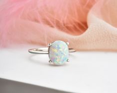 * Stunning handmade solid gold opal ring. This ring is designed to look elegant from all sides of your finger. You will not be able to take your eyes off the fascinating color of opal stone and the magnificent glitter of solid gold. 14K and 18K options are avaliable. It is suitable for daily use * ★Item Details ♥Made to Order ♥Gold Kt: 14K & 18K ♥Available Gold Color: Gold, Rose Gold, White Gold ♥Opal Stone Size: 09 x 07 mm Oval ♥Ready to Ship in 1 - 3 Business Days ✔ Shipped to the Worldwid Fine Jewelry Opal Ring Oval Cabochon Birthstone, Fine Jewelry Opal Oval Cabochon Ring, Oval Opal Gemstone Rings, Oval Opal Ring With Polished Finish, White Gold Oval Opal Ring, White Gold Oval Opal Gemstone Ring, Fine Jewelry Oval Opal Ring With Polished Finish, White Gold Opal Ring With Gemstone In Oval Shape, Oval Opal Ring With Polished Finish In Fine Jewelry