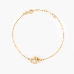 Showcase your love with the Interlocking Heart Bracelet in 14K Solid Gold. This meticulously crafted double heart bracelet for women is the perfect representation of eternal connection and affection. As a piece of 14k gold jewelry, it offers enduring shine and durability. Ideal as a couple bracelet or a thoughtful gift for her, this bracelet seamlessly blends style, sentiment, and quality. Its unique design and solid gold appeal make it a must-have addition to any jewelry collection. 14k solid g Delicate Yellow Gold Heart Bracelet, Heart-shaped Yellow Gold Formal Bracelets, Heart-shaped Yellow Gold Bracelets For Formal Occasions, Elegant 14k Gold Bracelets For Valentine's Day, 14k White Gold Promise Bracelets, Delicate Yellow Gold Heart Bracelet For Anniversary, Formal Heart-shaped Yellow Gold Bracelets, Elegant Open Heart Bracelets For Mother's Day, White Gold 14k Promise Bracelets