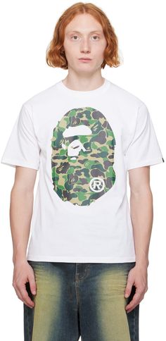 Cotton jersey T-shirt. · Rib knit crewneck · Logo graphic printed at front and back · Logo flag at cuff Supplier color: White X green Bathing Ape, A Bathing Ape, Knit Crewneck, Mens Green, Green Shorts, Logo Graphic, T Shirt For Men, Jersey T Shirt, Rib Knit