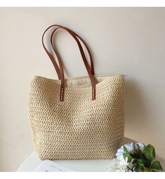 IN STOCK FAST SHIPPING FROM LOS ANGELES The Elena Handbags Straw Woven Tote is a luxurious summer staple crafted out of woven straw and reinforced with leather straps. With its spacious, zippered interior, this bag is the perfect accessory for day trips and evening events alike, offering effortless elegance wherever you go. Size: 30cm wide x 33cm tall (12in x 13in) Designer Style ID: 8322 Large Straw Woven Tote Bag with Leather Straps, Summer Bag, Everyday Shoulder Bag, Beach Bag Brown Braided Bags For Beach Season, Everyday Braided Rattan Bag, Brown Rattan Shoulder Bag With Large Capacity, Brown Large Capacity Rattan Shoulder Bag, Vacation Straw Bag With Braided Handles, Large Capacity Brown Rattan Shoulder Bag, Spring Handwoven Brown Shoulder Bag, Travel Braided Rattan Bags, Spring Brown Handwoven Shoulder Bag