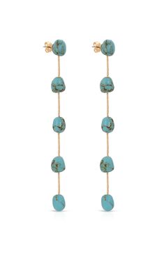 Online Only! Add a touch of vibrant elegance with Ettika's Dripping Turquoise 18k Gold Plated Earrings, featuring turquoise beaded accents delicately strung on a gold chain with a secure post-back closure. These earrings blend luxury with bohemian charm, perfect for elevating your summer wardrobe.


	18k gold plated Brass Semi-precious Turquoise
	Length: 4.25"
	Post back closure Turquoise Drop Earrings, Gold Plated Earrings, Underworld, Turquoise Beads, Pacsun, Summer Wardrobe, Gold Chain, Gold Chains, Semi Precious