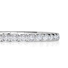 This exquisite bracelet features an impressive 11.25ct of oval cut diamonds set in lustrous 18K white gold. The diamonds are exceptional quality, with E-F color and VS1-VS2 clarity, ensuring maximum brilliance and sparkle. The unique stretch design of this bracelet allows for a comfortable and secure fit on any wrist size, making it easy to wear and perfect for everyday glamour. The flexibility of the bracelet ensures it stays in place while providing a luxurious and elegant look. Oval Cut Diamond, Tennis Bracelet, Oval Cut, Stretch Bracelets, Precious Metals, Tennis, Diamonds, White Gold, Sparkle