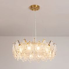 a chandelier hanging from the ceiling in a room