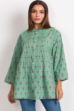 Our Amisha Cotton Tunic is a popular new addition to our sustainable apparel collection. Made with printed 100% cotton fabric, this fair trade tunic features a button down front and roll up button sleeves. These soft cotton tunic tops are free size, and are designed for an elegant, comfortable fit up to size XXL. One size fits most. Cotton Tunic Blouse With Buttons, Casual Cotton Kurta With Button Closure, Green Floral Print Long Sleeve Kurta, Spring Straight Kurta Blouse With Printed Motifs, Casual Cotton Tunic Kurta, Green Floral Print Tunic Blouse, Casual Cotton Tunic With Buttons, Cotton Button-up Tunic For Daywear, Casual Cotton Button-up Tunic