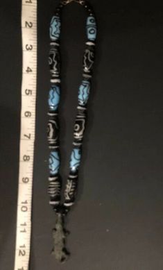 Very Very Old! Antique African AKAN/ASHANTI Necklace Crocodile Pendant with mixed beads. One is an old feather, black and white bead. One looks hand painted black & white. There are several blue/black beads that look Venetian. There are also many smaller black, ribbed round beads with white edge. Crocodile is made of sold brass. He's approx 2 inches. Necklace Choker is approx 12 inches. Ashanti also known as Asante, are part of the Akan ethnic group and are native to the Ashanti Region of mo Traditional Long Necklace With Black Beads, Traditional Long Beaded Necklace With Black Beads, Artisan Black Beads Necklace For Festival, Traditional Turquoise Beaded Necklace With Wooden Beads, Traditional Turquoise Beaded Necklaces With Wooden Beads, Artisan Black Beaded Necklaces For Jewelry Making, Traditional Blue Jewelry With Wooden Beads, Traditional Long Beaded Necklaces With Wooden Beads, Traditional Long Beaded Necklace With Wooden Beads