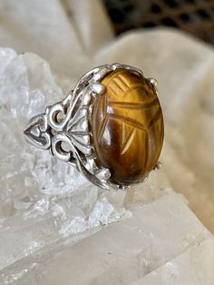 Art Deco Egyptian Revival Carved Tigers Eye Scarab Sterling Silver Vintage Ring ring size 6 Adjustable Symbolic Carved Rings, Vintage Adjustable Carved Ring, Symbolic Carved Round Ring, Artisan Carved Rings, Symbolic Carved Ring, Unique Carved Round Rings, Artisan Carved Adjustable Ring, Spiritual Carved Round Ring, Brown Carved Round Jewelry