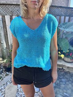 Hand knitted turquoise top V-neck Textured Knit Beach Sweater, Casual V-neck Knit Top For Beach, Beach Crew Neck Top With Textured Knit, Vacation Crew Neck Knit Top, Vacation V-neck Knit Top, Knitted Crew Neck Top For The Beach, Light Blue Knitted Crew Neck Top, Light Blue Knit V-neck Top, Light Blue Crew Neck Knitted Top