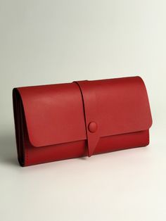 "This  long wallet  model that can be used as a wallet or a mini clutch for daily walks.  A red wallet can accommodate not only banknotes, it will also take care of your credit cards, coins and mobile phone Product details: It has 12 card slots, one compartment for coins, two compartments for banknotes and one compartment for the phone. The wallet will be tough on delivery, but it softens nicely after a couple of weeks of wearing. Material: Italian  red leather Leather color: red Sizes are gener Red Wallet With Interior Card Slots For Daily Use, Versatile Rectangular Trifold Wallet As Gift, Versatile Red Travel Wallet, Modern Red Everyday Wallet, Red Leather Trifold Wallet For Daily Use, Red Rectangular Trifold Wallet For Daily Use, Red Bifold Clutch With Card Slots, Red Clutch With Card Slots For Daily Use, Red Trifold Rectangular Wallet