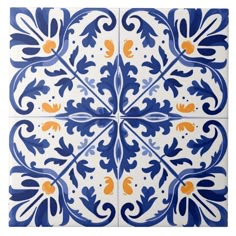 a blue and white tile with orange accents