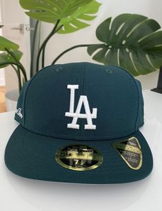 • Green fitted hat • Grey undervisor • New Era 59Fifty • Low-profile silhouette • Embroidered Dodgers logo at center-front • Embroidered Aimé Leon Dore logo on side panel • 100% Polyester • Made in China New Era size guide below Runs large. Recommend sizing down for your usual fit. SIZE 7 7⅛ 7¼ 7⅜ 7½ 7⅝ 7¾ 7⅞ CIRC (IN) 22 22⅜ 22¾ 23⅛ 23½ 23⅞ 24¼ 24⅝ CIRC (CM) 55.8 56.8 57.7 58.7 59.6 60.6 61.5 62.5